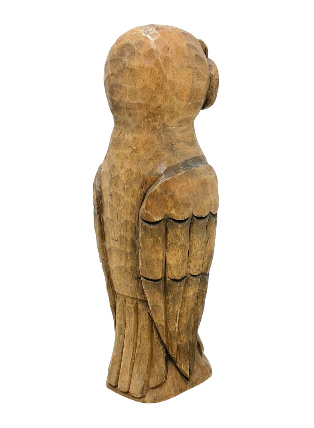 Close-up of carved wooden owl with intricate details and vintage charm.
