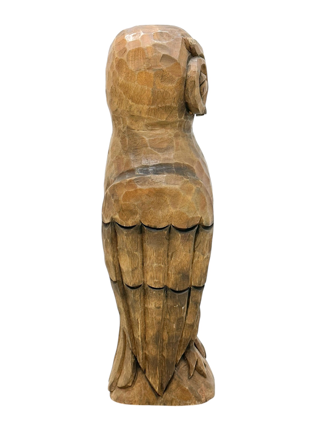 Rear view of hand-carved wooden owl with intricate details, showcasing rustic charm.