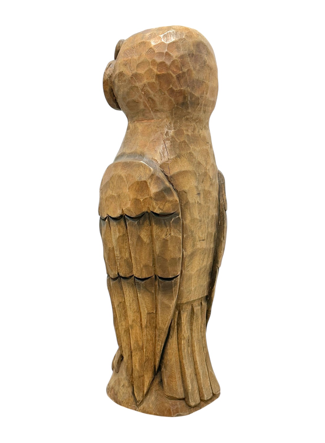 Close-up of vintage carved wooden owl, showcasing intricate details and rustic charm.