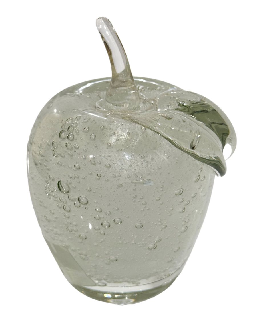 Close-up of vintage crystal apple, circa 1990s, reflecting light with intricate details.