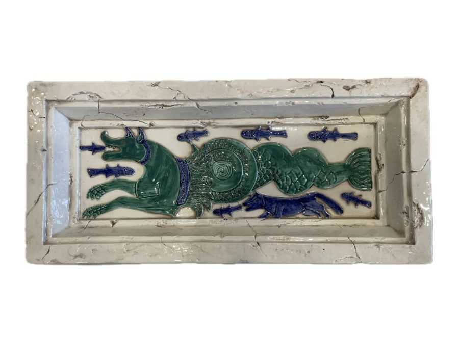 Close-up vintage dragon ceramic tray in teal and blue, circa 1994.