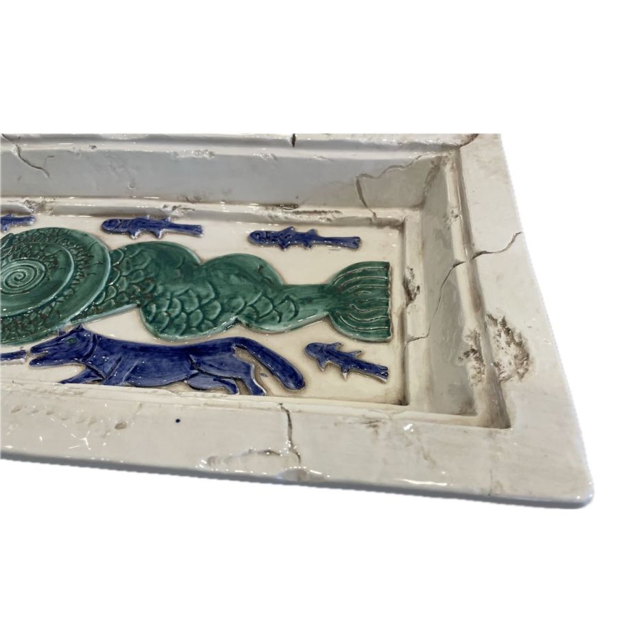 Close-up of blue dragon on ceramic tray, vintage hand painted detail, circa 1994 Italian art piece.