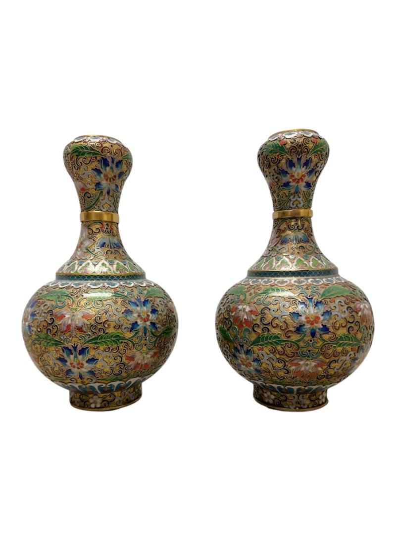 Beautiful pair of vintage Chinese cloisonné vases with intricate patterns and brass accents.
