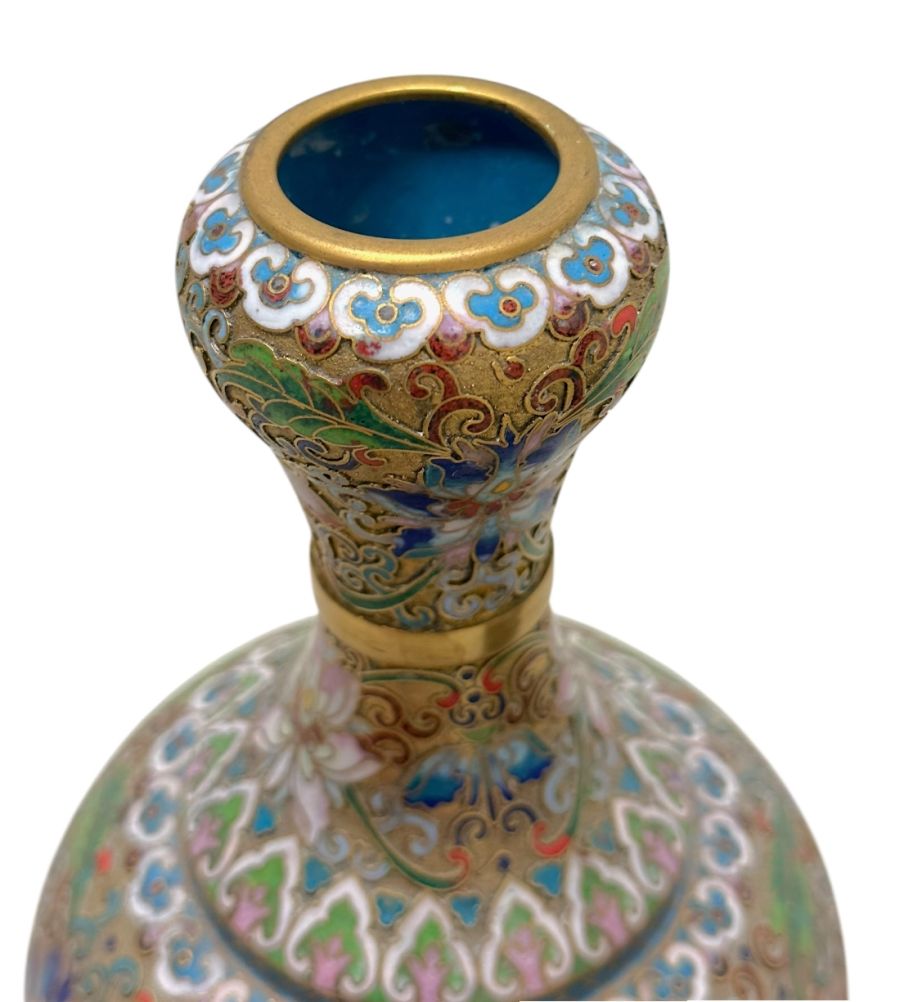 Ornate cloisonné vase, intricate floral design, vibrant colors, brass accents, vintage appeal.