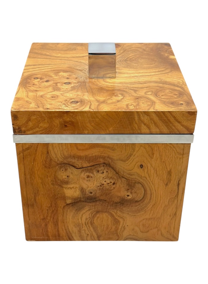 Shiny chrome lid atop burlwood ice bucket with intricate wood grain pattern.