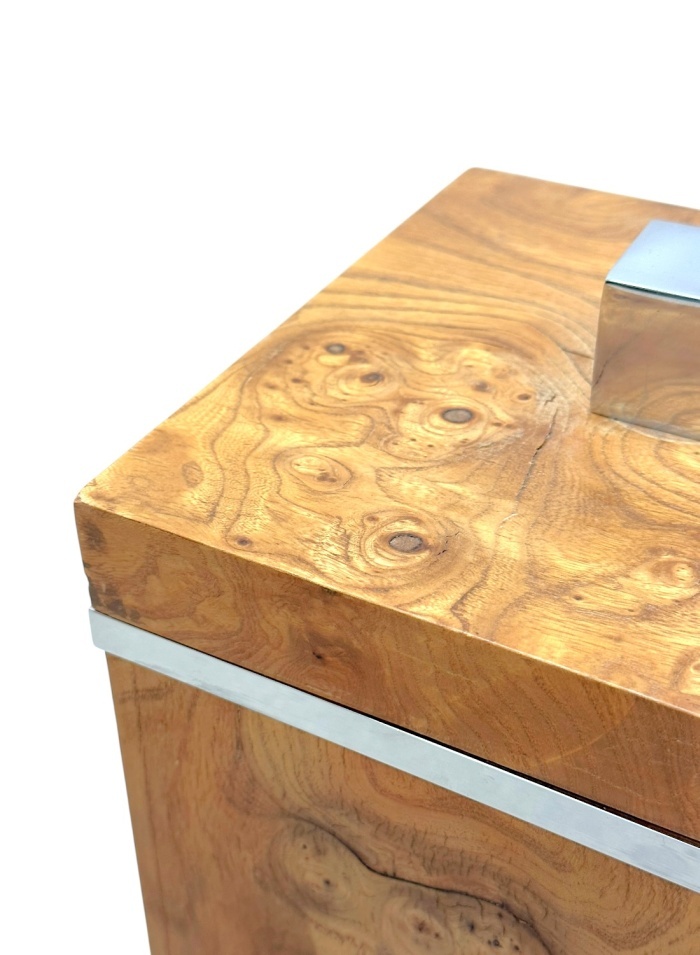 Close-up of vintage chrome and burlwood ice bucket, showcasing intricate wood grain pattern.