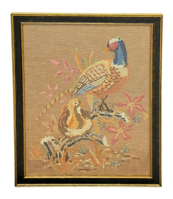 Vintage bird and flower cross stitch art in black and gold frame, showcasing intricate details and vibrant colors.