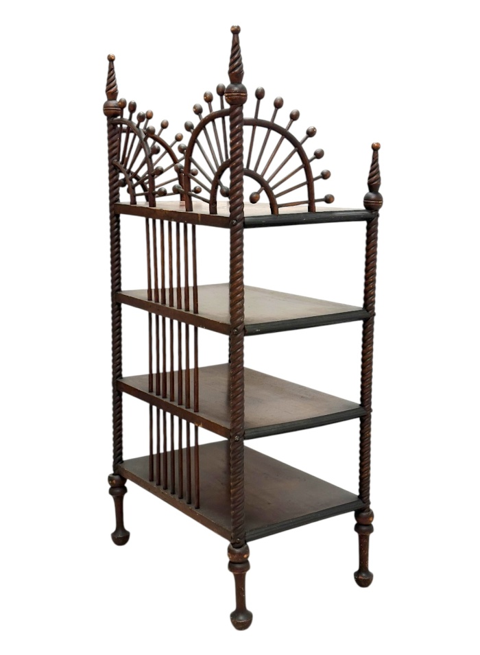 Elegant antique etagere with intricate turned wood frame and four shelves.